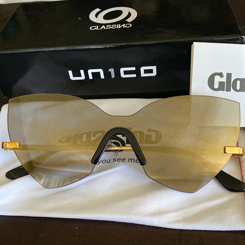 Glassing mirrored Italian sunglasses.